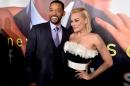 Actors Will Smith (L) and Margot Robbie arrive at the premiere of Warner Bros. Pictures' "Focus" at the Chinese Theatre on February 24, 2015, in Los Angeles, California