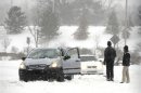 Stranded motorists are seen during a blizzard in Overland Park, Kansas