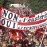 Demonstrators march during a rally holding a banner which reads,"no to the austerity, yes to the the social Europe", to protest against the austerity measures announced by the French government, in Paris, Sunday, Sept 30, 2012. (AP Photo/Michel Euler)