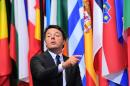 Italian Prime Minister Matteo Renzi points a finger as he leaves the European Union leaders summit on October 21, 2016 at the European Council, in Brussels