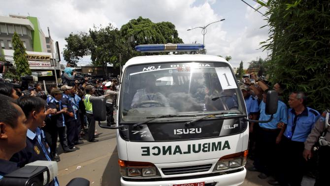 Ambulance carrying one of the bodies of two Australians who were executed earlier, arrives at a funeral home in Jakarta, Indonesia