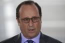 French President Francois Hollande delivers a speech following the arrival of French former hostage Isabelle Prime, who was kidnapped in Yemen, at the Villacoublay airbase, near Paris, August 7, 2015