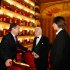 FILE - In this Friday, Nov. 18, 2011 file photo, then, Russian President Dmitry Medvedev, left, speaks with choreographer Yuri Grigorovich, center, and Bolshoi ballet art director Sergei Filin as he attends the premiere of Sleeping Beauty in the Bolshoi Theater  in Moscow, Russia. Filin was attacked Thursday night, Jan. 17, 2013, by an unknown person who splashed acid onto his face. (AP Photo/RIA Novosti, Dmitry Astakhov, Presidential Press Service, File )