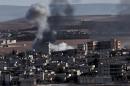 Smoke rises after an airstrike on Syria's Kobane, October 9, 2014. A US-Turkish team will meet to discuss the fight against IS