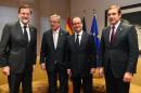 (L-R) Spanish Prime Minister Mariano Rajoy Brey, European Commission President Jean-Claude Juncker, French President Francois Hollande and Portuguese Prime Minister Pedro Passos Coelho meet European Union leaders summit in Brussels