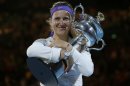 Victoria Azarenka of Belarus hugs her trophy after winning the women's final against China's Li Na at the Australian Open tennis championship in Melbourne, Australia, Saturday, Jan. 26, 2013. (AP Photo/Andy Wong)