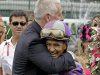 Trainer Todd Pletcher hugs jockey Mike Smith after Smith rode Princess of Sylmar to a win in the 139th Kentucky Oaks at Churchill Downs Friday, May 3, 2013, in Louisville, Ky.(AP Photo/Garry Jones)