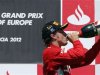 Ferrari Formula One driver Alonso drinks champagne during the podium ceremony after the European F1 Grand Prix at the Valencia street circuit