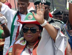 Patience Jonathan (C) waves as she campaigns for her …