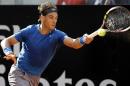 Spain's Rafael Nadal returns the ball to Russia's Mikhail Youzhny during their match at the Italian Open tennis tournament, in Rome, Thursday, May 15, 2012. (AP Photo/Andrew Medichini)