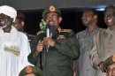 Sudan's President Omar al-Bashir addresses supporters outside the military headquarters in Khartoum