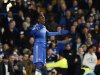 Chelsea's Demba Ba reacts after receiving a yellow card during English League Cup semi-final soccer match against Swansea City in London