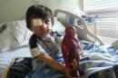 This Feb. 2014 photo provided by Flor Medrano shows Kevin Vicente in Phoenix, Ariz. Four-year-old Kevin Vicente's road to recovery after a dog mauling on Feb. 20, 2014, has ignited thousands of impassioned pleas, not just not for him. The animal behind the attack is now the object of a Facebook page that has garnered more than 39,000 likes on Facebook. The fate of Mickey the pit bull will ultimately be decided in a court hearing March 25 in Phoenix. Guadalupe Villa, who was at the scene of the attack, has filed a vicious-animal petition to have the dog put down. Doctors say the attack has left the boy unable to swallow properly or open one eye. They say Kevin faces months, if not years, of reconstructive surgery.(AP Photo/)