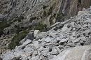 In this photo supplied by Yosemite National Park, a rockfall is seen on Monday, March 31, 2014. Officials at Yosemite National Park say a massive amount of rock has fallen from a cliff, closing a hiking trail. The National Park Service said nobody was hurt on March 31 when approximately 16,000 tons of rock fell 500 feet from a cliff near Hetch Hetchy Reservoir. Officials say the rock crashed down from a cliff east of Wapama Falls. Some 400 feet of the Rancheria Falls Trail were destroyed and park staff says it will remain closed for now. Park officials say hikers can still get to Wampama Falls starting at O'Shaughnessy Dam. (AP Photo/Yosemite National Park)
