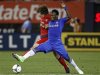 Chelsea's Michael Essien battles for the ball against Paris St Germain's Adrien Rabiot in the second half of their team's friendly soccer match at Yankee Stadium, the home of the New York Yankees baseball team, in New York