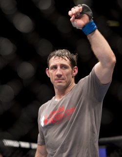 Tim Kennedy celebrates his victory over Michael Bisping in 2014. (AP)