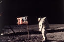 FILE - In this July 20, 1969 file photo provided by NASA shows astronaut Edwin E. "Buzz" Aldrin Jr. posing for a photograph beside the U.S. flag deployed on the moon during the Apollo 11 mission. Aldrin and fellow astronaut Neil Armstrong were the first men to walk on the lunar surface. The trio was launched to the moon by a Saturn V launch vehicle at 9:32 a.m. EDT, July 16, 1969. They departed the moon July 21, 1969. (AP Photo/NASA, Neil Armstrong, File)