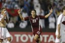 Qatar's Sebastian Soria celebrates after scoring a goal against Lebanon during their 2014 World Cup qualifying soccer match in in Doha