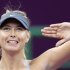 Maria Sharapova of Russia reacts after defeating Samantha Stosur of Australia during their women's quarter-final match at the Qatar Open tennis tournament in Doha