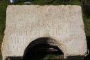 A stone bearing an ancient Latin inscription is displayed for the media outside Rockefeller Archaeological Museum in Jerusalem