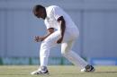 West Indies's Shannon Gabriel celebrates dismissing England captain Alistair Cook during day two of their third Test match at the Kensington Oval in Bridgetown, Barbados, Saturday, May 2, 2015. (AP Photo/Ricardo Mazalan)