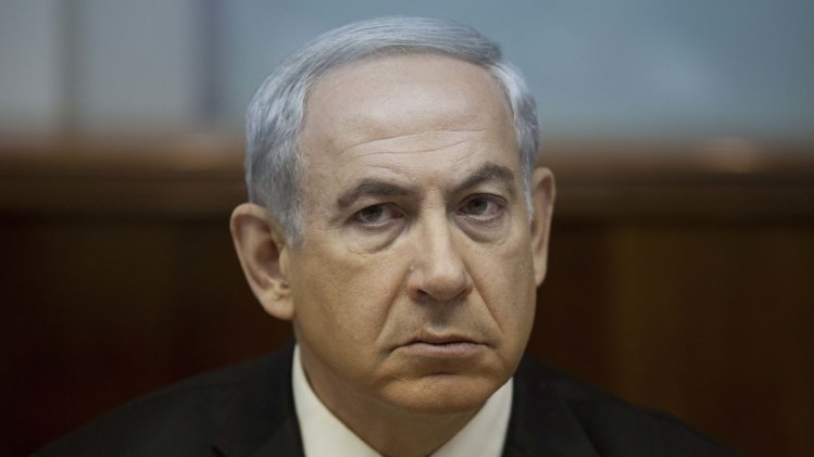 FILE -This Sept. 1, 2013 file photo shows Israeli Prime Minister Benjamin Netanyahu during the weekly cabinet meeting in Jerusalem, Israel. Mortified that the world may be warming up to Iran, Netanyahu is taking an unpopular message to the White House and the United Nations this week: Don't be fooled by Tehran's new leadership. With the White House cautiously optimistic about its dialogue with Iran, the meeting on Monday, Sept 30, 2013 between Netanyahu and President Barack Obama could be tense. (AP Photo/Abir Sultan, Pool, file)