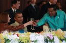 U.S. President Barack Obama watches on as Cambodia's Prime Minister Hun Sen toasts with Australian Prime Minister Julia Gillard at an East Asia Summit dinner in Phnom Penh