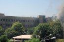 This photo released by the Syrian official news agency SANA, shows smoke rising from Syria's army command headquarters in Damascus, Syria,Wednesday, Sept. 26, 2012. Twin blasts targeting Syria's army command headquarters rocked the capital on Wednesday, setting off hours of sporadic gunbattles and a raging fire inside the heavily guarded compound, state-run media and witnesses said. (AP Photo/SANA)