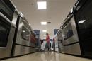 A woman walks by stoves in the appliance section at a Sears store in Schaumburg, Illinois near Chicago