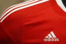 Adidas logo is pictured at shirt before company annual general meeting in Fuerth