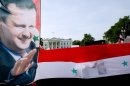 Supporters of Syrian President Bashar Al-Assad take part in a demonstration in Washington, DC, on September 9, 2013