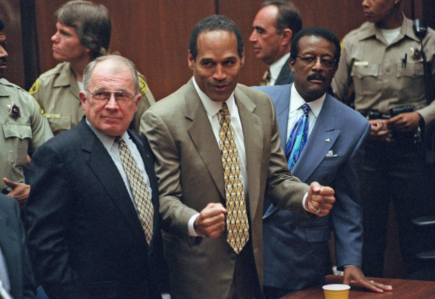 FILE - In this Oct. 3, 1995 file photo, O.J. Simpson, center, reacts as he is found not guilty of murdering his ex-wife Nicole Brown and her friend Ron Goldman, as members of his defense team, F. Lee Bailey, left, and Johnnie Cochran Jr., right, look on, in court in Los Angeles. The return of O.J. Simpson to a Las Vegas courtroom next Monday, May, 13, will remind Americans of a tragedy that became a national obsession and in the process changed the country's attitude toward the justice system, the media and celebrity. The return of O.J. Simpson to a Las Vegas courtroom next Monday, May, 13, will remind Americans of a tragedy that became a national obsession and in the process changed the country's attitude toward the justice system, the media and celebrity.(AP Photo/Pool, Myung J. Chun, file)