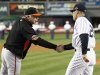 Baltimore Orioles manager Showalter shakes hands with New York Yankees manager Girardi before Game 3 of their MLB ALDS baseball playoff series in New York