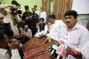 Jamil Afridi, right, brother of a Pakistani doctor Shakil Afridi speaks at a news conference in Peshawar, Pakistan on Monday, May 28, 2012. The brother of a doctor sentenced to 33 years for helping the United States track down Osama bin Laden, says that his brother is innocent and Pakistani trial that convicted him was a sham. (AP Photo/Mohammad Sajjad)