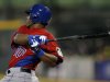 Dominican Republic's Edwin Encarnacion hits an RBI single off Puerto Rico's starting pitcher Orlando Roman in the first inning of their World Baseball Classic first round game in San Juan, Puerto Rico, Sunday, March 10, 2013. (AP Photo/Andres Leighton)