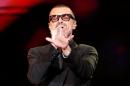 FILE PHOTO British singer George Michael performs on stage during his "Symphonica" tour concert in Berlin