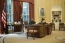 US President Barack Obama speaks on the phone in the Oval Office of the White House on August 8, 2014 in Washington, DC
