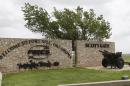 A sign is pictured at Scott Gate, one of the entrances to Fort Sill, in Fort Sill, Okla., Tuesday, June 17, 2014. (AP Photo/Sue Ogrocki)