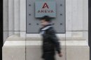 A man walks past French nuclear reactor maker Areva headquarters in Paris