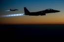This US Air Forces Central Command photo released by the Defense Video & Imagery Distribution System (DVIDS) shows a pair of US Air Force F-15E Strike Eagles flying over northern Iraq early in the morning of September 23, 2014