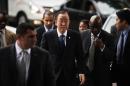 United Nations Secretary General Ban Ki Moon (C) arrives for a visit at the Mandela Foundation and Centre of memory on December 9, 2013 in Johannesburg, South Africa