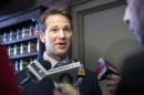 In this Feb. 6, 2015 photo, Rep. Aaron Schock, R-Ill., answers questions from the media as he returns to Peoria, Ill., to speak to the Peoria County Farm Bureau. A shell company linked to Schock paid a political donor $300,000 last year for a commercial property in Peoria then took out a $600,000 mortgage for the property from a local bank run by other donors, Illinois state and county records show. (AP Photo/Journal Star, Fred Zwicky)