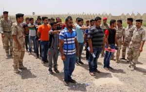 FILE - This June. 12, 2014 file photo shows Iraqi men&nbsp;&hellip;