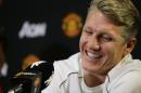 Bastian Schweinsteiger smiles as he talks to reporters after being introduced as a new singing with Manchester United, during a news conference Wednesday, July 15, 2015, in Bellevue, Wash. Manchester United is in the Seattle are for an international friendly soccer match against Mexico's Club America to be played Friday. (AP Photo/Ted S. Warren)