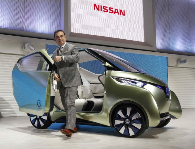 Ghosn, chairman and CEO of Nissan and Renault, poses with Nissan's PIVO3 at the 42nd Tokyo Motor Show in Tokyo