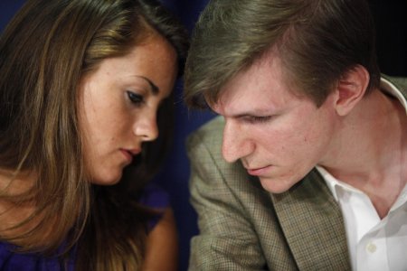 This October 2009 file photo shows Hannah Giles, left, talking with James O'Keefe III during a news conference at the National Press Club in Washingto...