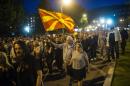 Protesters shout slogans in Skopje on April 21, 2016, during a protest against the president's shock decision to halt probes into more than 50 public figures embroiled in a wire-tapping scandal