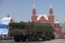 FILE - In this Tuesday, May 7, 2013 file photo, Russian Iskander missiles make their way through Red Square during a rehearsal for the Victory Day military parade in Moscow, Russia. Russia's Defense Ministry said Monday Dec. 16, 2013, that deployment of Iskander missiles in western part of the country doesn't violate any international agreements. (AP Photo/Alexander Zemlianichenko, File)