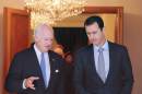 A picture released by the official Syrian Arab News Agency shows Syrian President Bashar al-Assad (R) speaking with Italian United Nations envoy on the Syrian crisis, Staffan de Mistura, after a meeting in Damascus on September 11, 2014