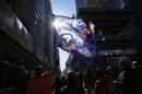 Fans walk along Super Bowl Boulevard fan zone ahead of Super Bowl XLVIII in New York